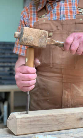 Wolfgang using a chisel to make a mortice and tenon joint